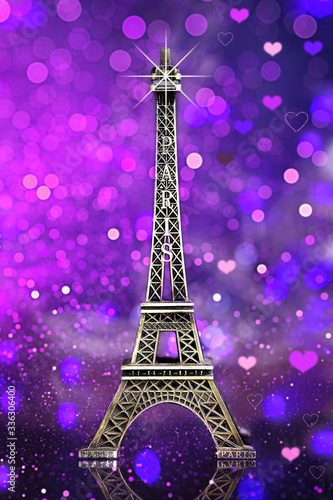 eiffel tower souvenir with purple bokeh shine  background and lights © Нарине Нахшкарян