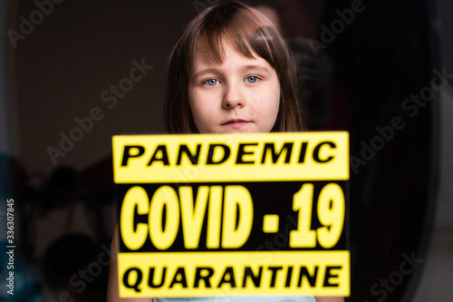 Stay at home. Sad lonely child isolation in quarantine. Concept quarantine, prevention COVID-19, Coronavirus outbreak situation.