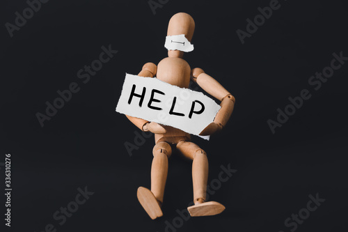 Wallpaper Mural Wooden mannequin with neutral mouth and text HELP on dark background. Concept of depression Torontodigital.ca