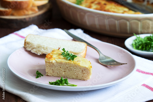 Dietary souffle of minced meat with parsley on a dark background.