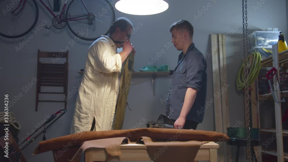 Workshop, apron, artisan and his student Workshop, apron, artisan and his student