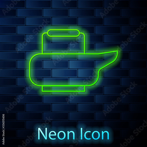 Glowing neon line Bedpan icon isolated on brick wall background. Toilet for bedridden patients. Vector Illustration