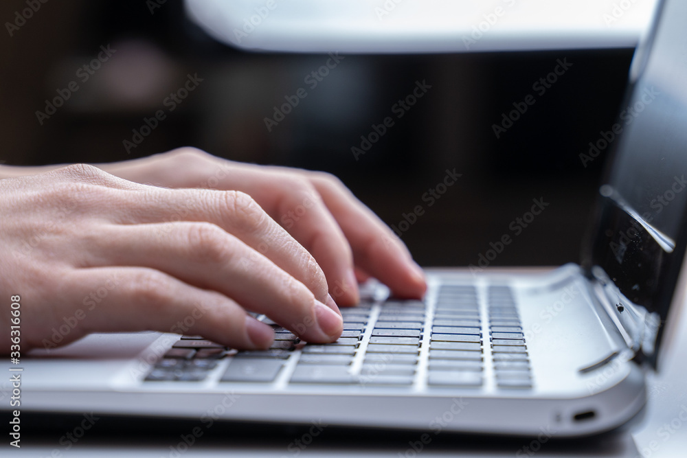 Working on laptop computer, typing on keyboard, modern office business. Woman hands print on the keyboard. Close-up. Working on laptop computer, typing on keyboard, modern office business. Woman hands print on the keyboard. Close-up.