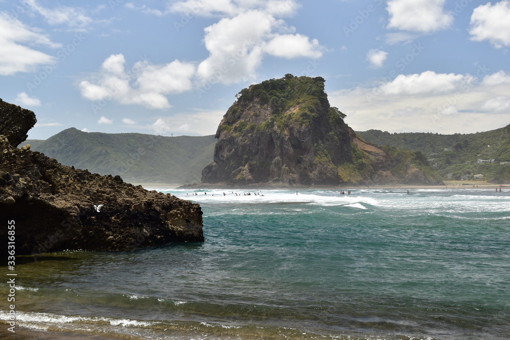 Remote wild beach with high cliffs and wild sea waves