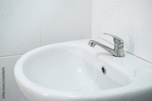Image of Interior of bathroom with sink and faucet, Modern square sink in the bathroom