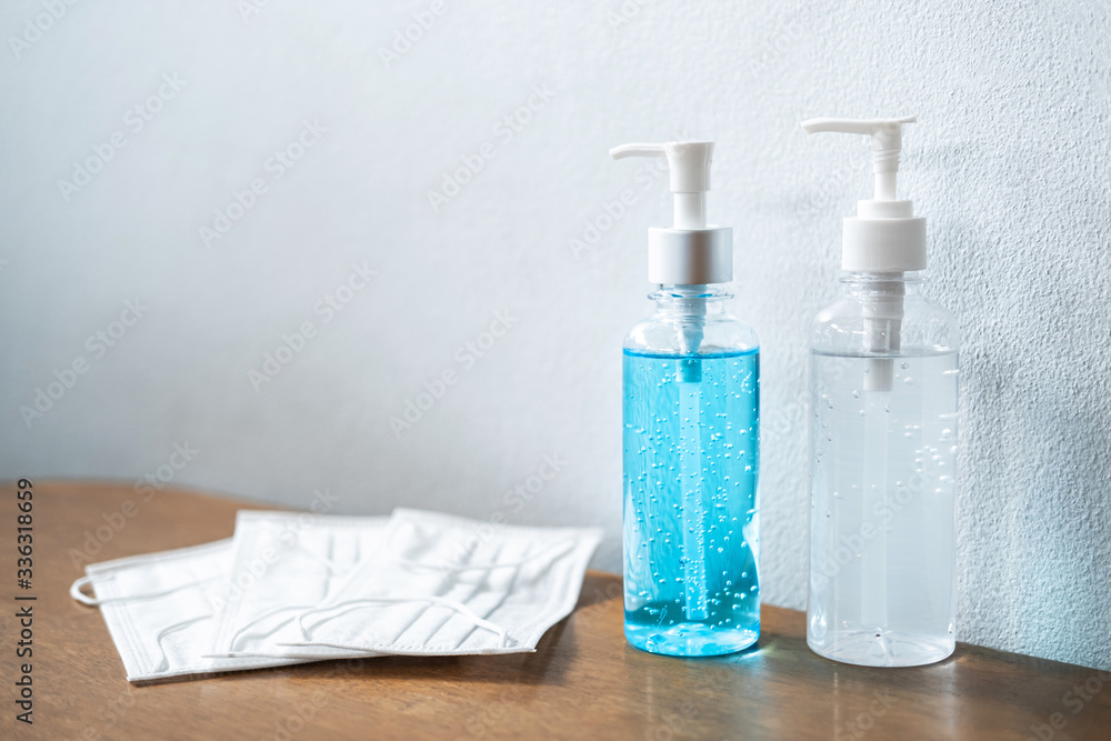 Image of medical surgical masks and alcohol sanitizer hand gel for cleaning hygiene protection corona virus or antibacterial Image of medical surgical masks and alcohol sanitizer hand gel for cleaning hygiene protection corona virus or antibacterial