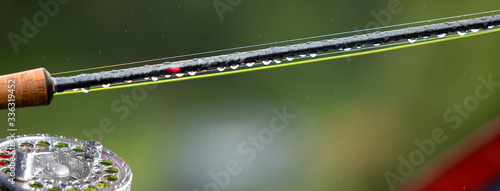 Canvas Print Fragment of a fly fishing rod with dew drops