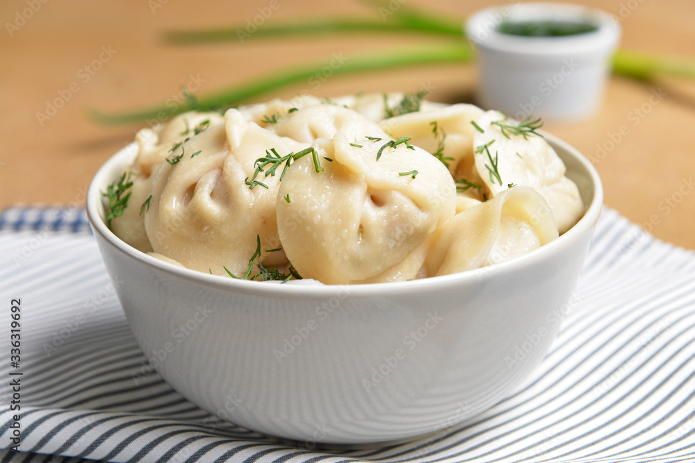Bowl with tasty dumplings on table Bowl with tasty dumplings on table