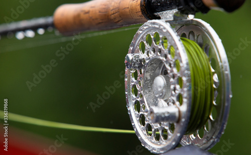 Foto Fragment of a fly fishing rod with dew drops