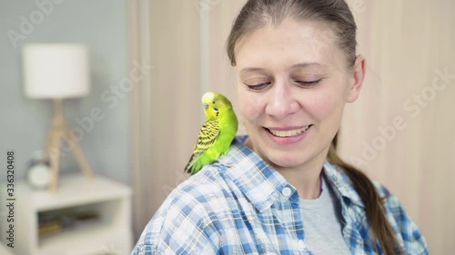 Woman Playing With Wavy Parrot At Home