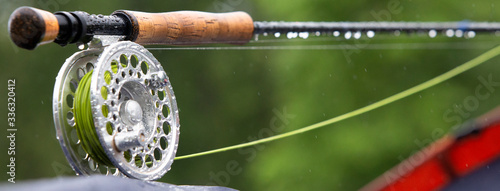 Photo Fragment of a fly fishing rod with dew drops