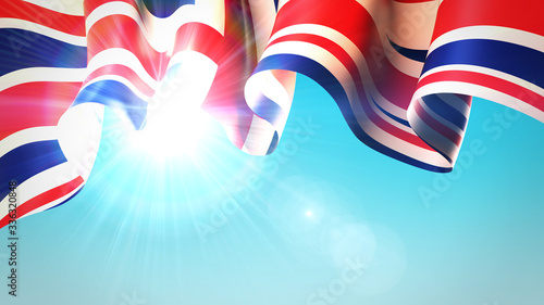 The sun shines through the waving United Kingdom flag. UK, great britain flag on blue sky for banner design. British holiday design. United Kingdom state patriotic template. 3d illustration photo