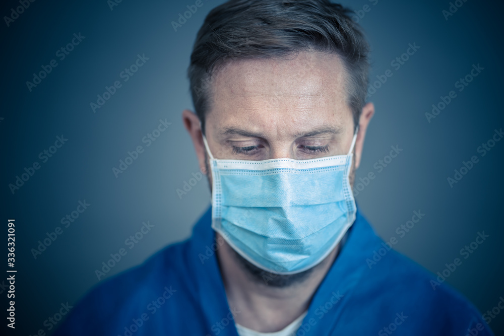 Male Doctor or Nurse Wearing Protective face medical Mask. Save lives from Covid-19 Outbreak Male Doctor or Nurse Wearing Protective face medical Mask. Save lives from Covid-19 Outbreak