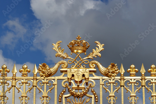 Elements of golden gates decorations at Versailles in Paris, France