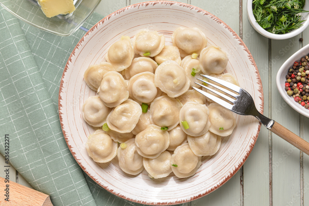 Plate with tasty dumplings on table Plate with tasty dumplings on table