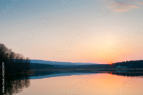 beautiful sunrise on the autumn lake © mikhailgrytsiv