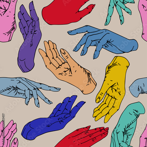Multi-colored hands on a beige background