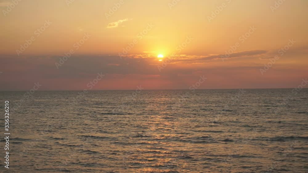 Beautiful sunset on the Sea. Yellow sun coming out of Sea. Orange sunset Beautiful sunset on the Sea. Yellow sun coming out of Sea. Orange sunset