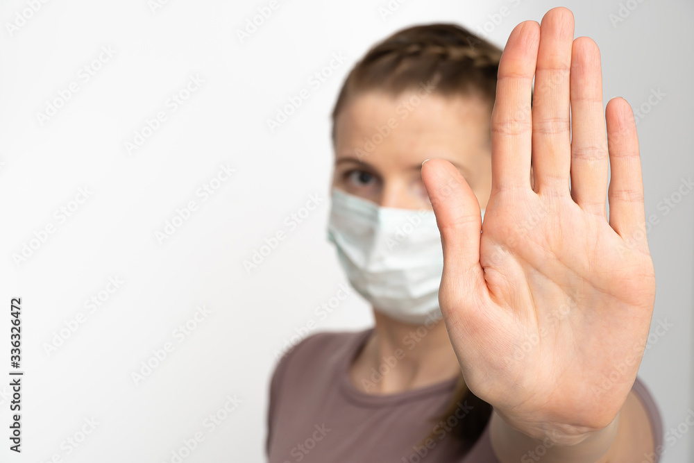 Say stop for coronavirus. Nice Woman show stop by hand, gesture for stop corona virus outbreak. Coronavirus and Air pollution pm2.5 concept. copy space Say stop for coronavirus. Nice Woman show stop by hand, gesture for stop corona virus outbreak. Coronavirus and Air pollution pm2.5 concept. copy space