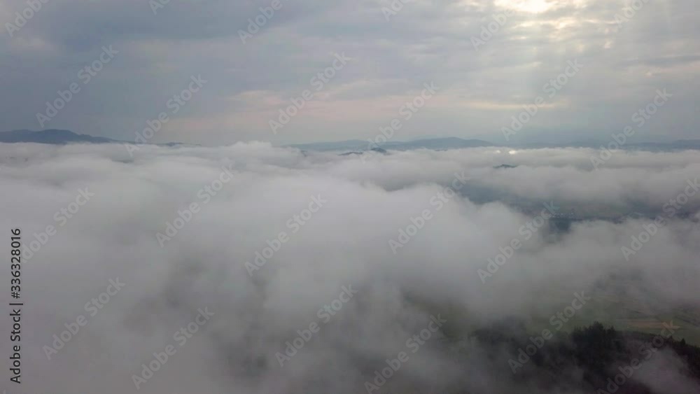 Drone flies over clouds in the early morning in the Slovak Tatras Drone flies over clouds in the early morning in the Slovak Tatras