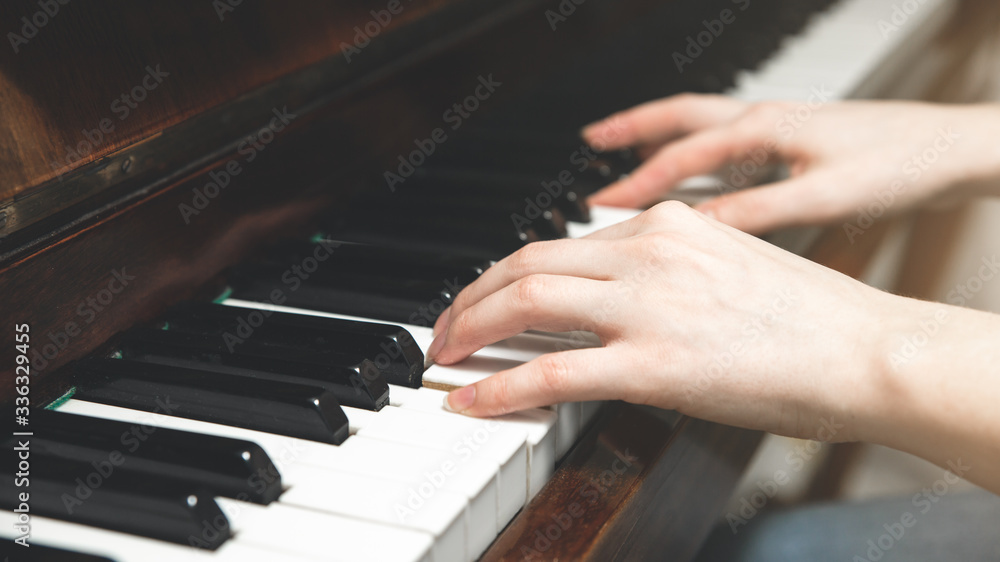 Girl is playing the piano. Music creating. Hobby on the quarantine time. Learn new things. Girl is playing the piano. Music creating. Hobby on the quarantine time. Learn new things.
