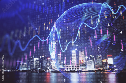 Canvas Print Financial graph on night city scape with tall buildings background multi exposure