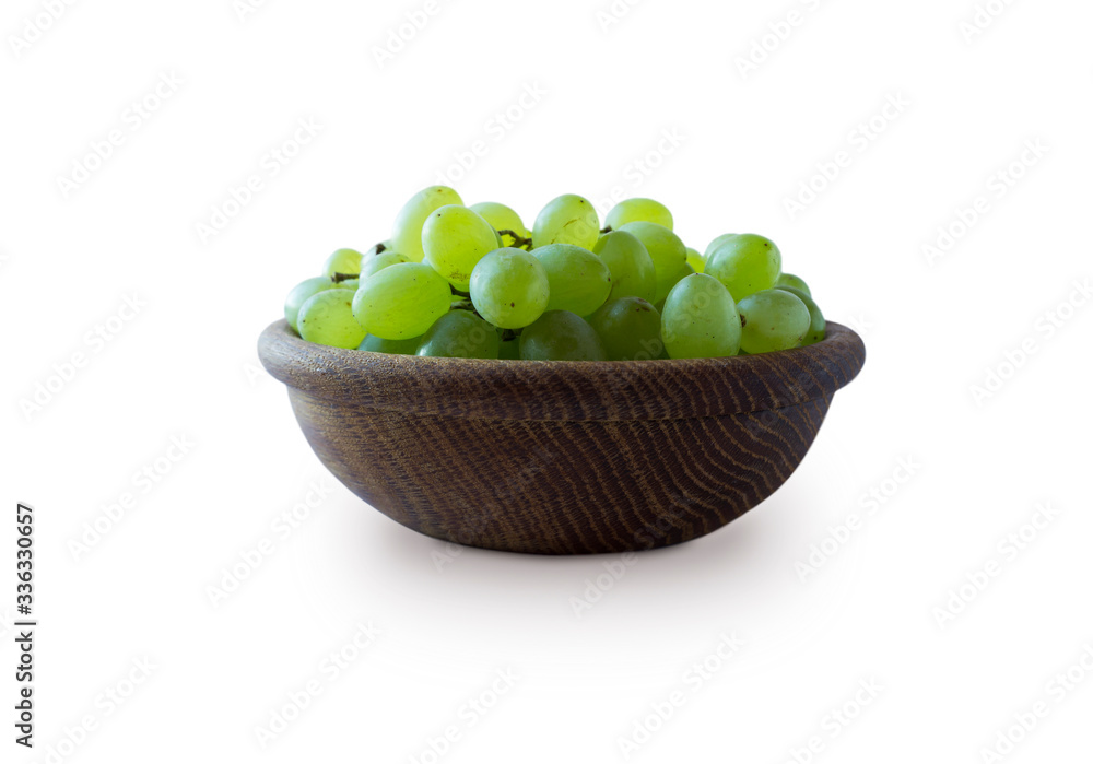 Green grapes Kishmish isolated on white background. Top view. Grapes in a wooden bowl isolated on white background. Vegetarian or healthy eating.Top view.Green grapes Kishmish with copy space for text Green grapes Kishmish isolated on white background. Top view. Grapes in a wooden bowl isolated on white background. Vegetarian or healthy eating.Top view.Green grapes Kishmish with copy space for text