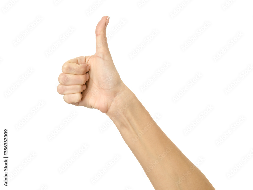 Thumb up. Woman hand gesturing isolated on white Thumb up. Woman hand gesturing isolated on white