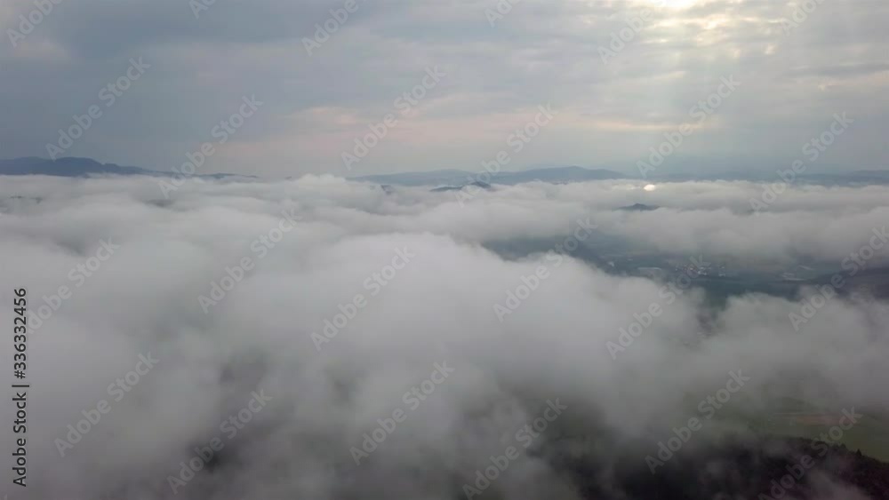 Drone flies over clouds in the early morning in the Slovak Tatras Drone flies over clouds in the early morning in the Slovak Tatras