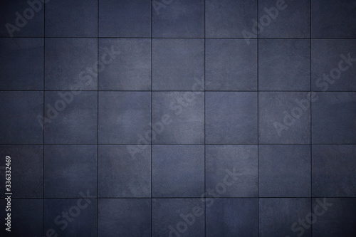 Abstract background from dark gray tiles