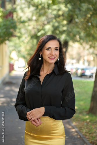 close portrait of attractive business woman in black shirt utdoors