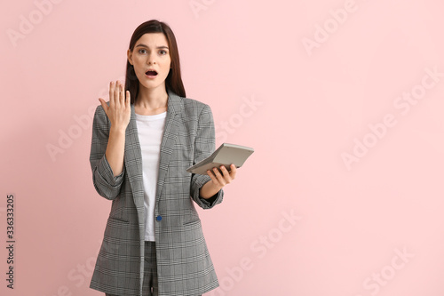 Shocked young woman with ca...