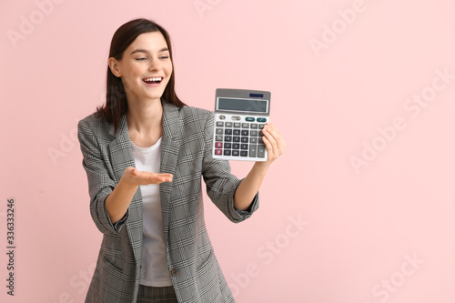 Young woman with calculator...