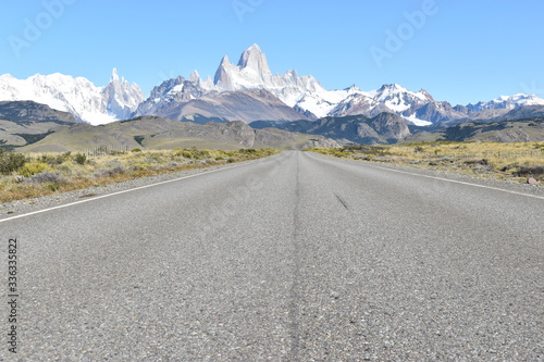 Street to Glacier National Park in El Chalten, Argentina, Patagonia with snow covered Fitz Roy Mountain in background