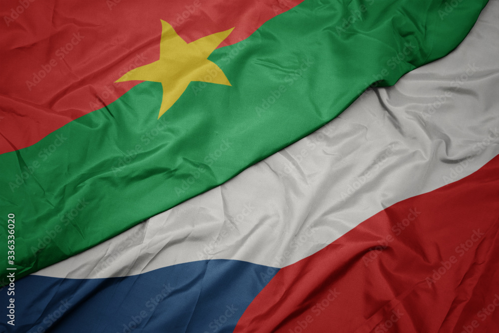 waving colorful flag of czech republic and national flag of burkina faso.