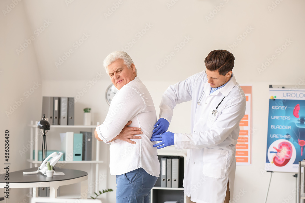Urologist examining senior patient in clinic Urologist examining senior patient in clinic