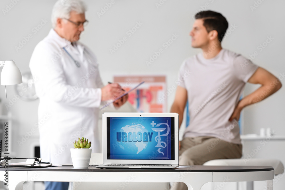 Fototapeta premium Modern laptop on table in urologist's office
