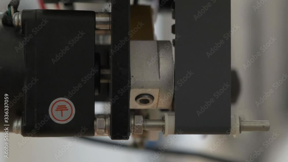 Workflow at the factory. The mechanism for actuating a metal nut. Detail closeup Workflow at the factory. The mechanism for actuating a metal nut. Detail closeup