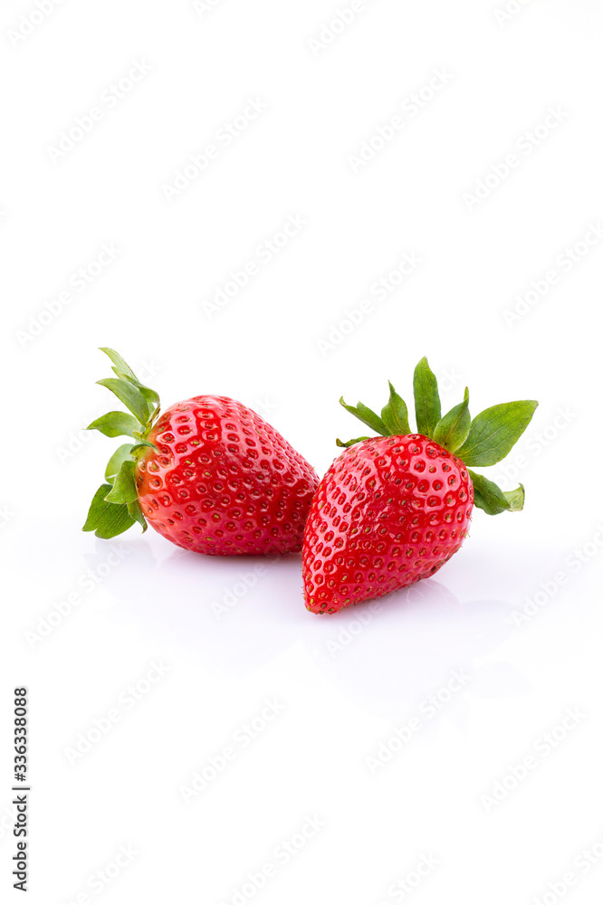 Two strawberries on a white background, isolate Two strawberries on a white background, isolate