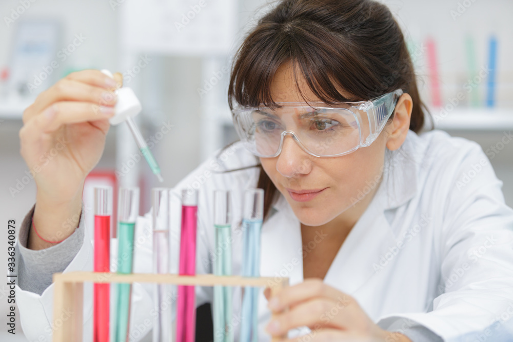 worman working with pipettes and tubes