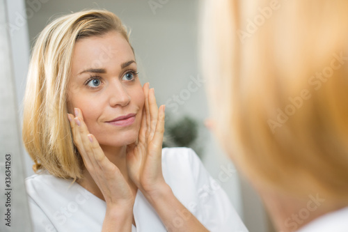a woman mirror and face