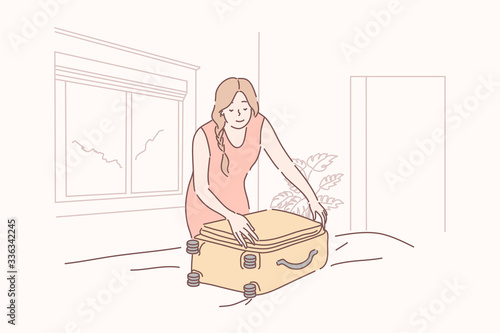 Vacation, tourism, holiday, arrival, hotel concept. Young happy woman or girl traveller tourist packs or unpacking suitcase. Preparation for vacation. Holiday recreation. Hotel arrival or departure.