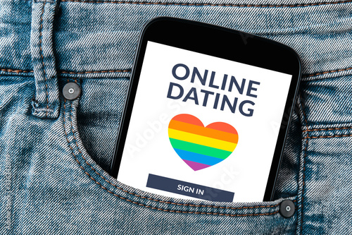 LGBT dating app concept on smartphone screen in jeans pocket. Gay online dating.