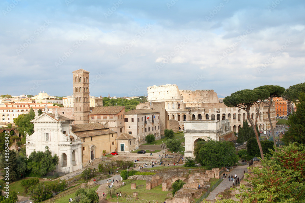 Aerial panoramic cityscape view of the Roman Forum during sunset in Rome, Italy