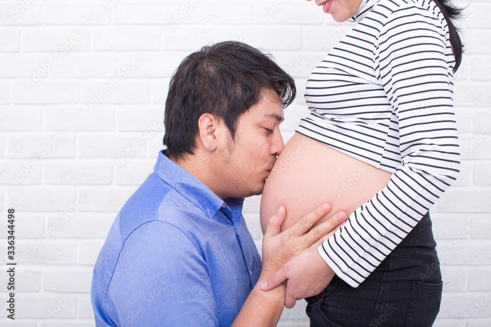 Pregnant mother and father. Young future parent happy together. Father and mother enjoying. Mom and dad. Asian people. Pregnant mother and father. Young future parent happy together. Father and mother enjoying. Mom and dad. Asian people.
