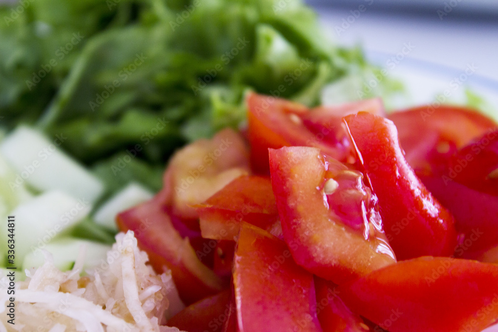 Salad with lettuce, tomato, onion and cucumber Salad with lettuce, tomato, onion and cucumber