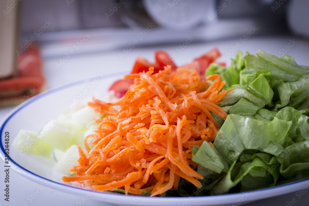 Lettuce, carrot, cucumber, tomato and onion salad Lettuce, carrot, cucumber, tomato and onion salad