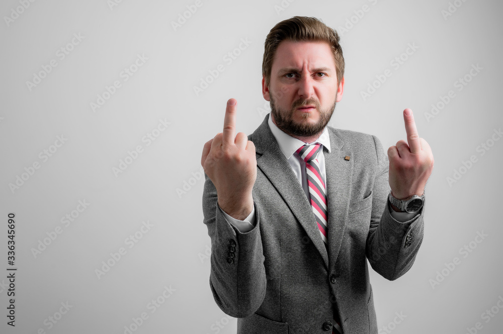 Portrait of business man wearing business clothes showing double obscene gesture Portrait of business man wearing business clothes showing double obscene gesture