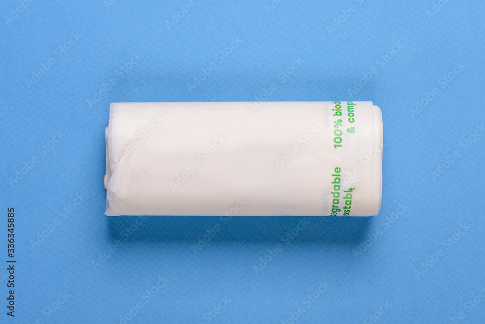 Obraz premium Biodegradable package isolated on the blue backround. Eco friendly.