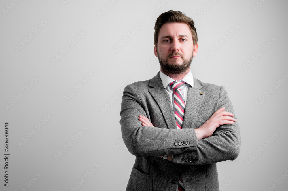 Portrait of business man wearing business clothes standing with arms crossed Portrait of business man wearing business clothes standing with arms crossed